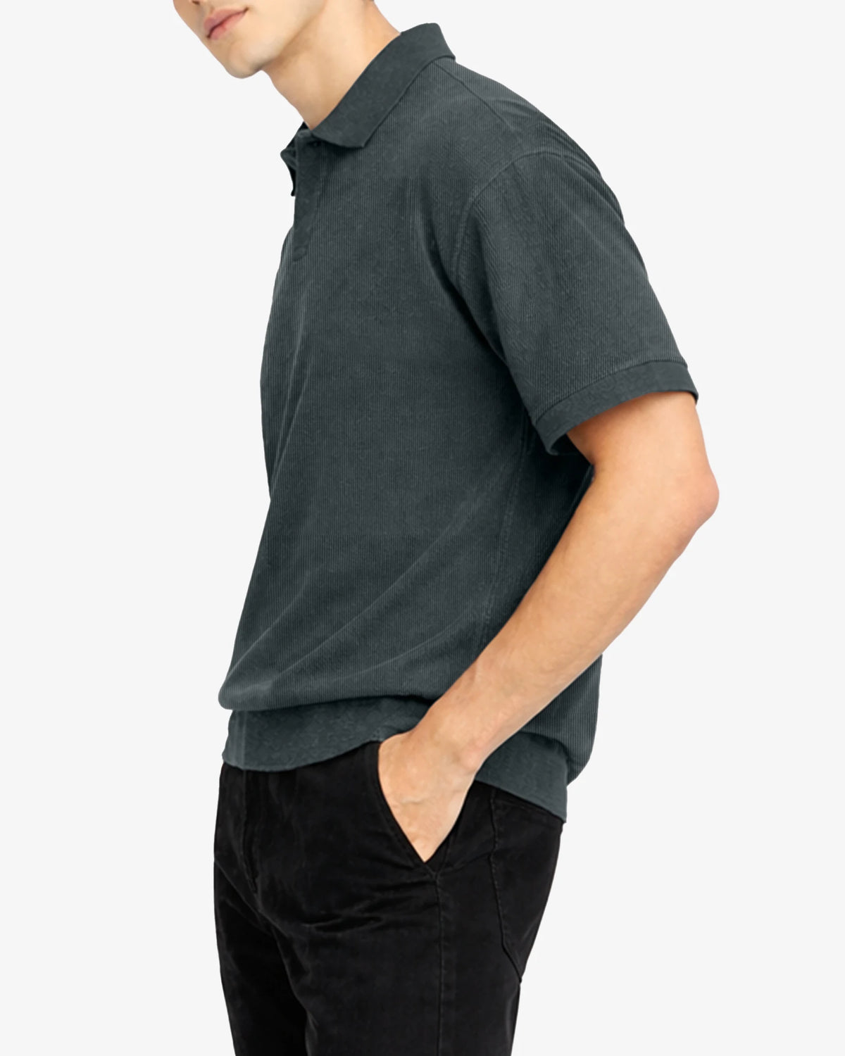 Person wearing a dark gray polo shirt and black pants on a white background