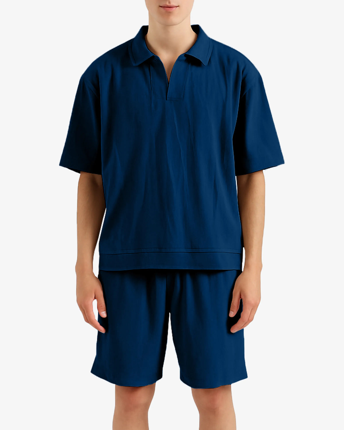 Person wearing a navy blue polo shirt and shorts set on a white background