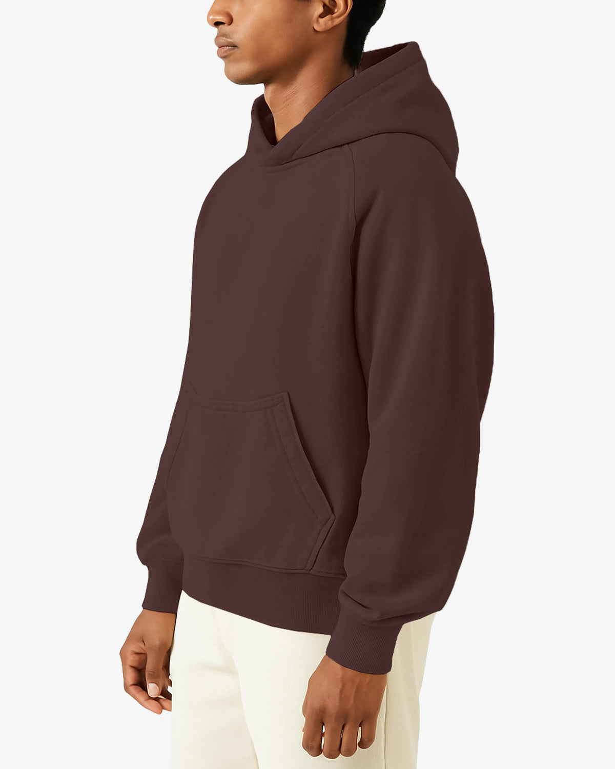 Person wearing a maroon hoodie on a white background