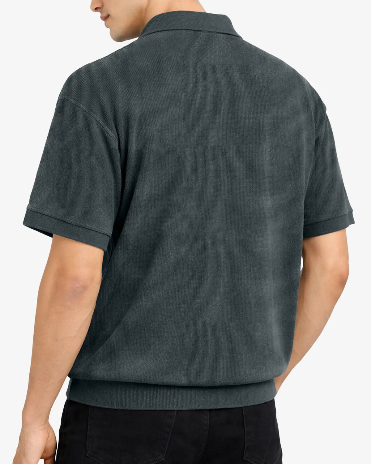 Person wearing a dark gray polo shirt on a white background