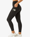 Black leggings worn by a person on a white background