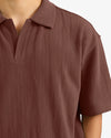 Brown polo shirt on a white background