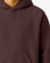 Close-up of a maroon hoodie on a white background