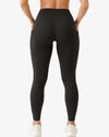 Black leggings worn by a person on a white background