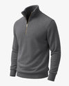 Gray half-zip sweater on a light gray background