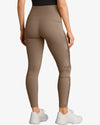 Beige leggings worn by a person on a white background