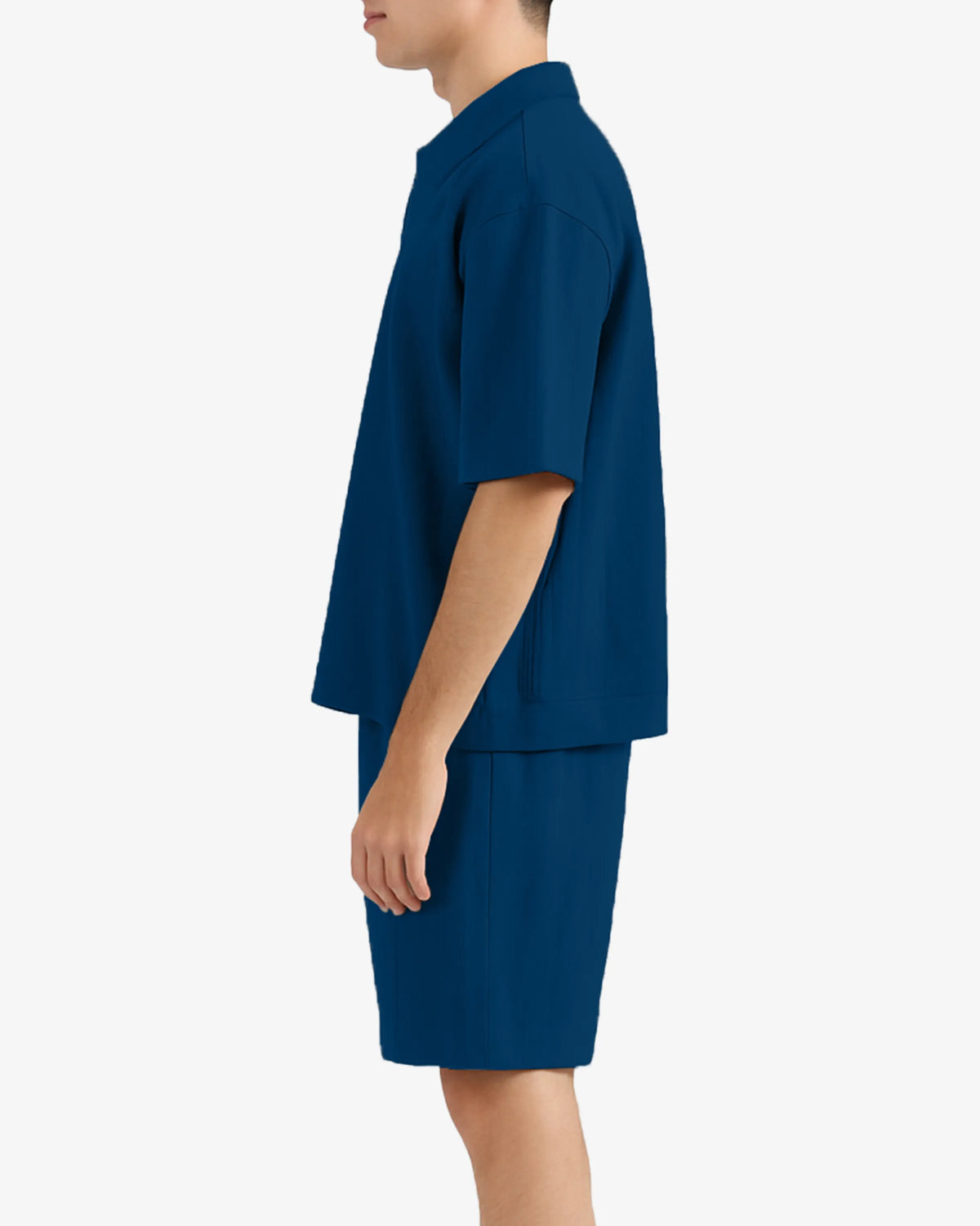 Person wearing a blue outfit on a white background