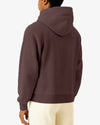 Person wearing a brown hoodie from behind on a white background