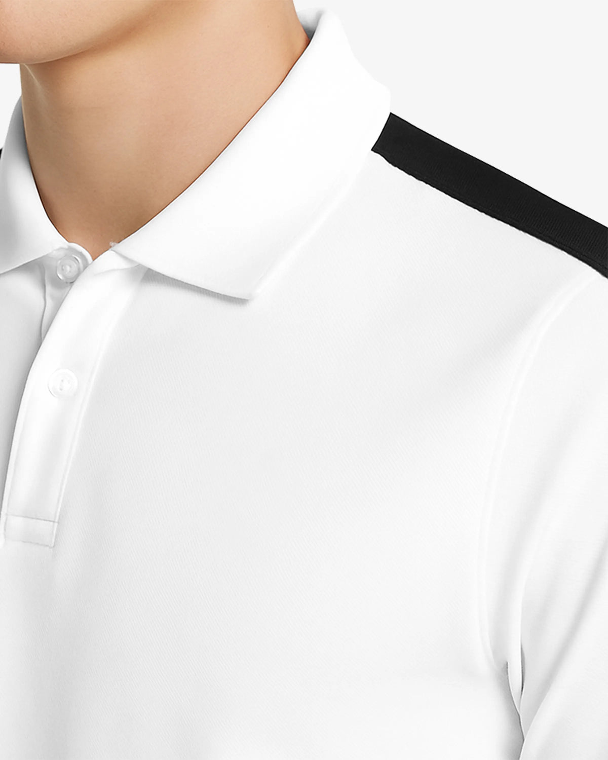 Close-up of a white shirt with black trim on a neutral background
