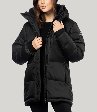 Person wearing a black puffer jacket on a light gray background