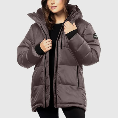 Person wearing a brown puffer jacket on a light gray background