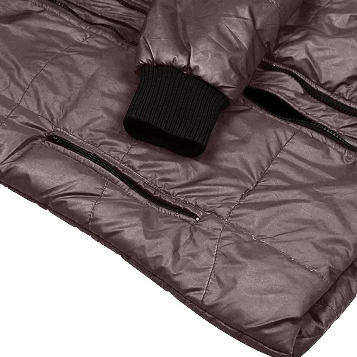 Close-up of a quilted brown jacket with a black zipper and button on a white background
