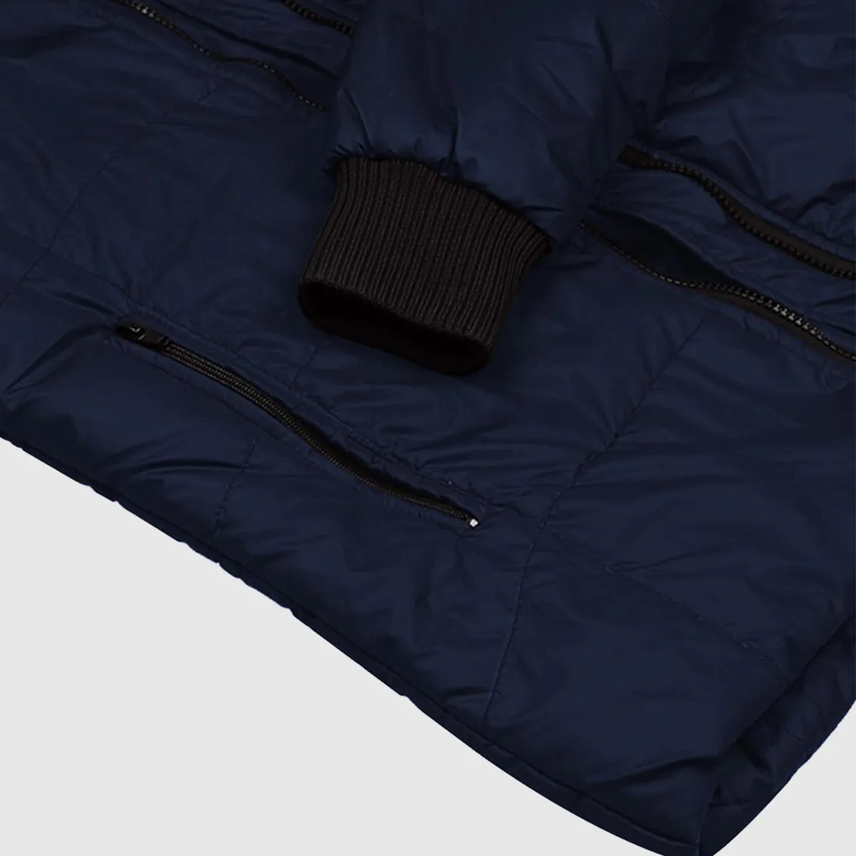 Navy blue puffer jacket with a black knit hat on a light gray background