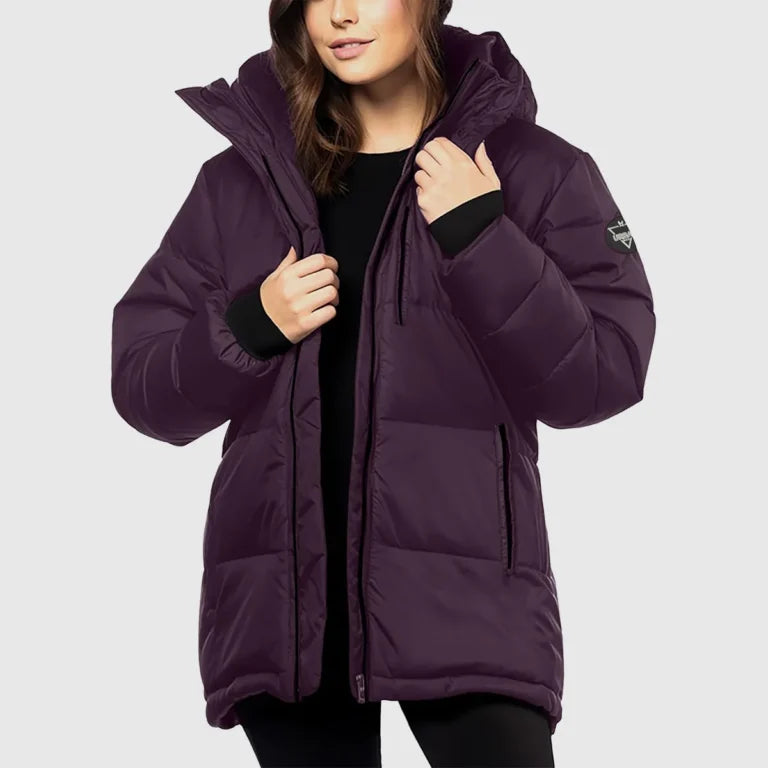 Purple puffer jacket worn by a person on a light gray background