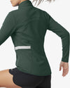 Green athletic jacket with reflective strip on a white background